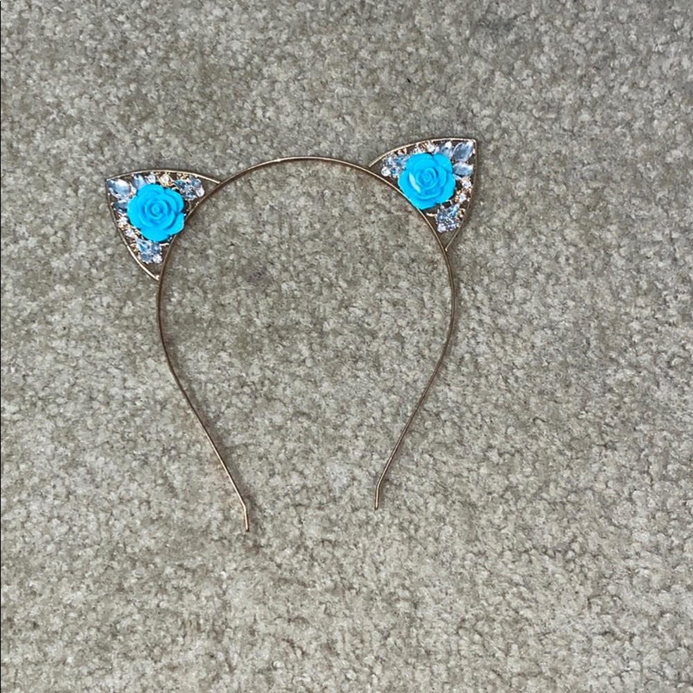 Cat ears with blue flowers in the middle